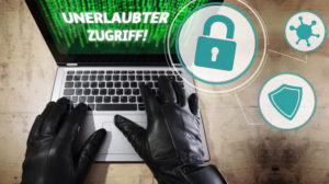 Es versucht sich jemand in einen Computer zu hacken. AUf dem Bildschirm erscheint der Schriftzug unerlaubter Zugriff.