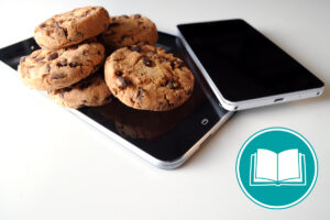 Smartphone mit Keksen auf dem Bildschirm